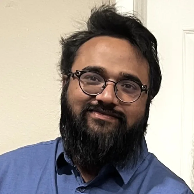 Headshot of Raja Kantheti smiling.